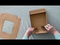Papierbox mit Fenster und Band